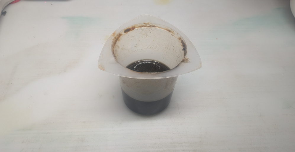 Yellow solution with brown precipitate