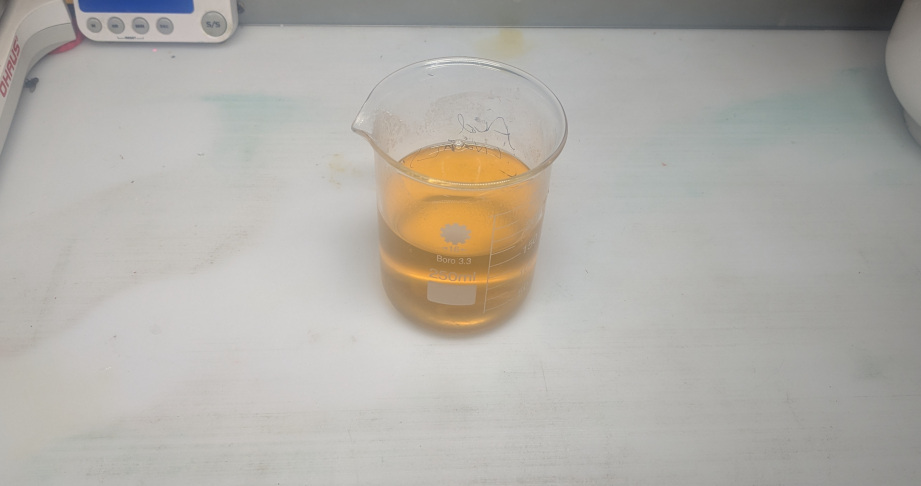 Straw colored solution