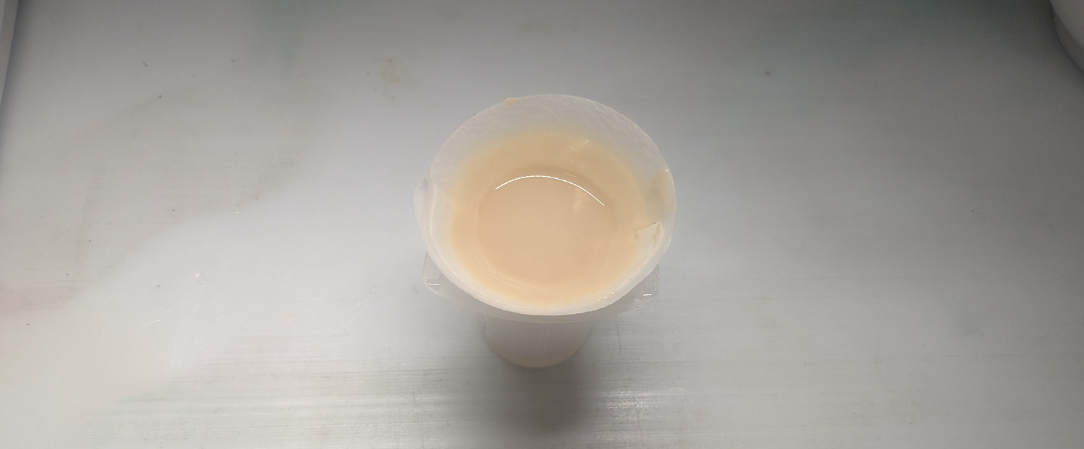 Light yellow paste in a filter