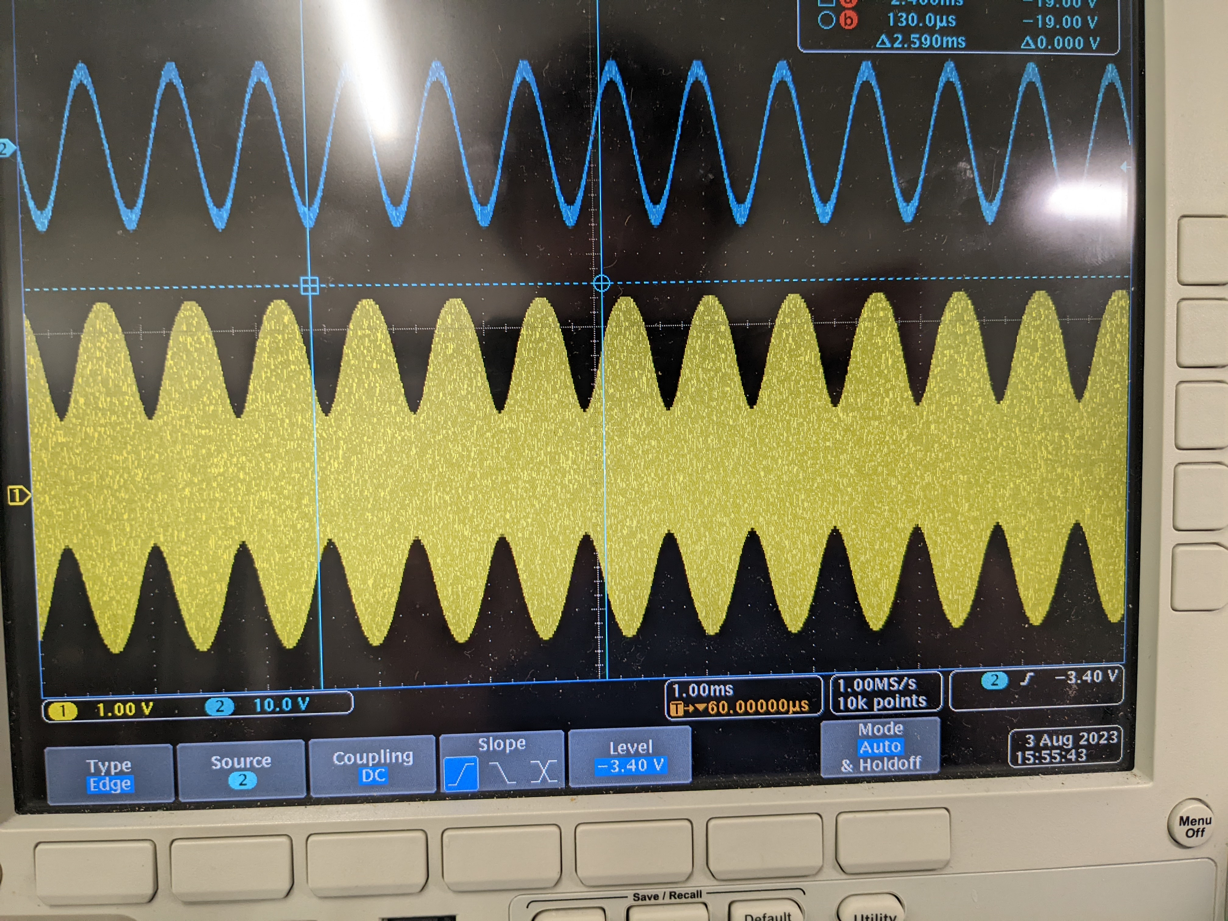 An oscilloscope trace showing a a 1KHz sine wave and a 1MHz signal amplitude modulated by the 1KHz signal