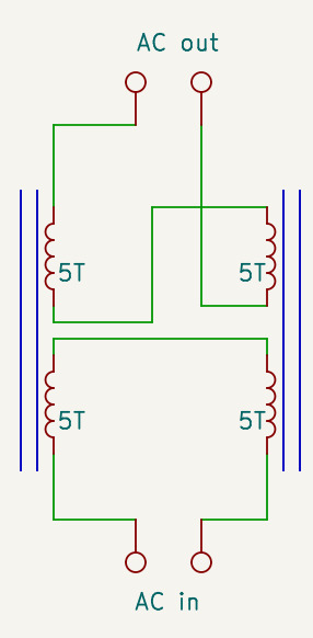Two transformers connected so that the signal that is coupled through one cancels out the signal from the other one