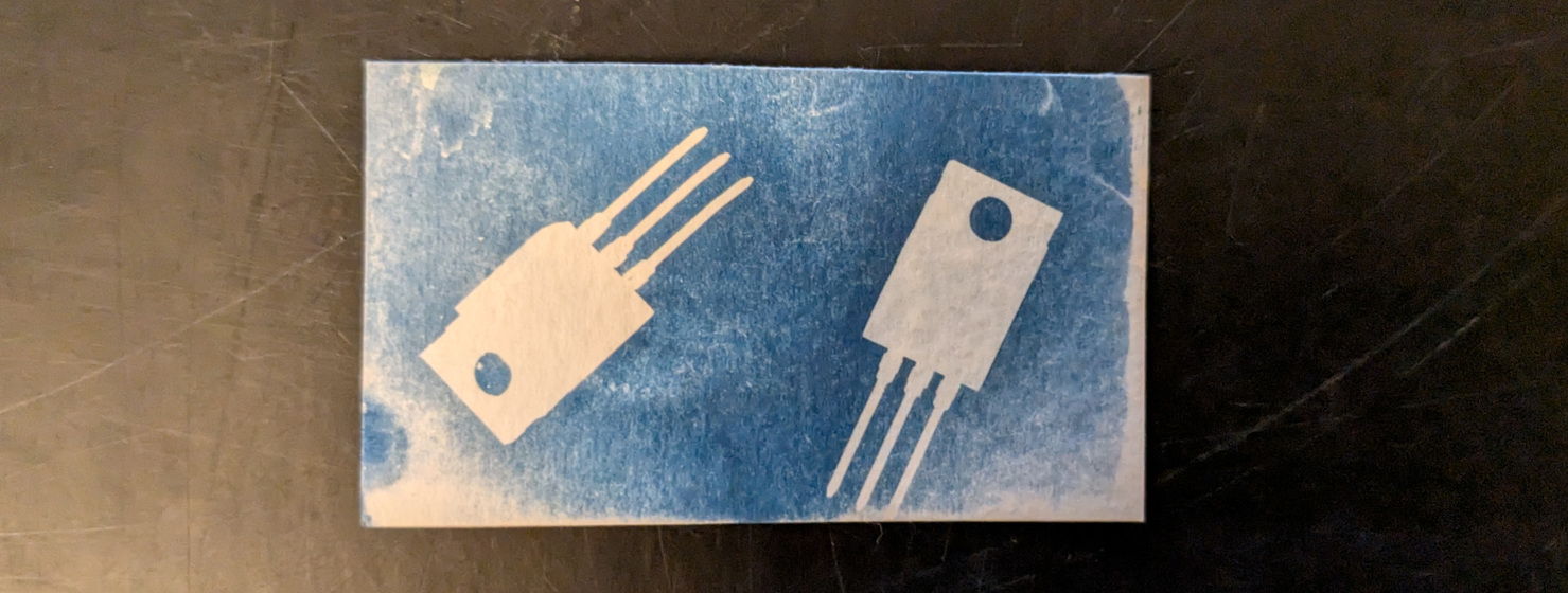 White-on-blue image of two MOSFETs