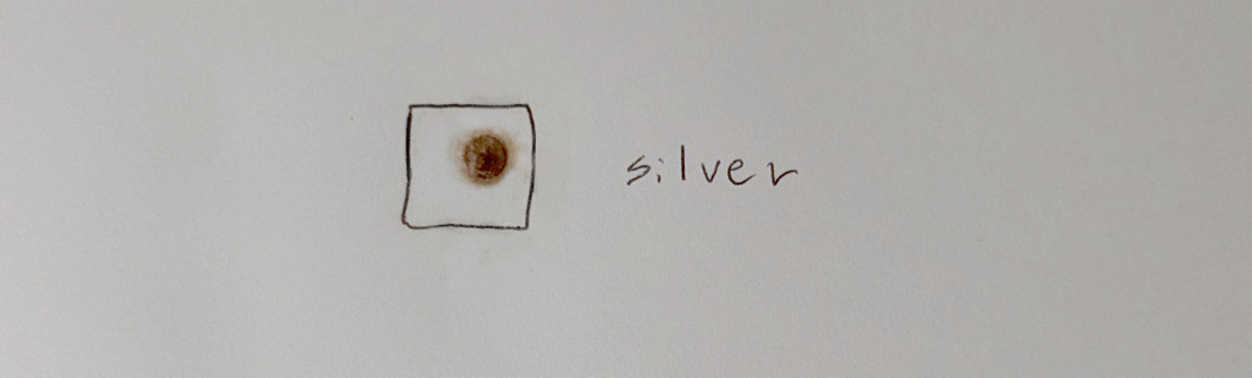 Dark brown spot on paper